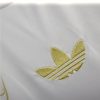 tunique-real-madrid-design-dragon-or-pour-supporter-du-club-version-collector-2425 Real Madrid gold dragon fan kit for club supporters collector version 2425