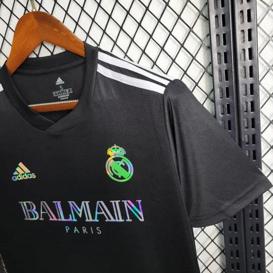 7FBB41CC1B27FB57A1EF7D4B8C7B6D2F_540x_f17aed9f-47b7-4596-a39c-a25c190fce10.jpg Real Madrid 2023-2024 Black Balmain Jersey
